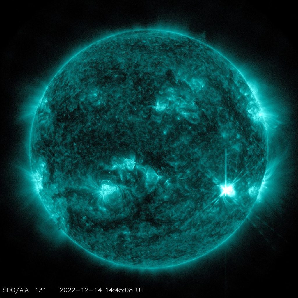 the Sun imaged by a space telescope with a bright flare at its limb